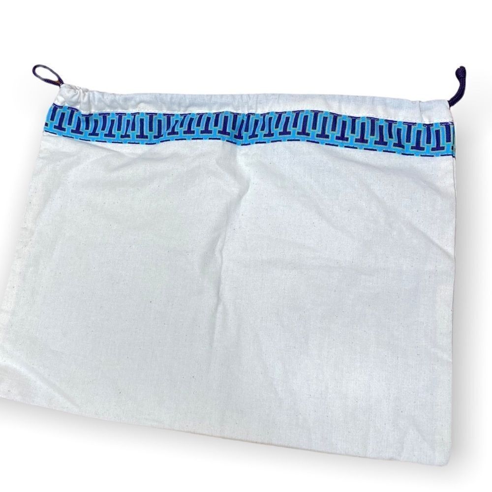 Tory Burch cream Dust bag with purple cord blue trim and gold signature hang tag